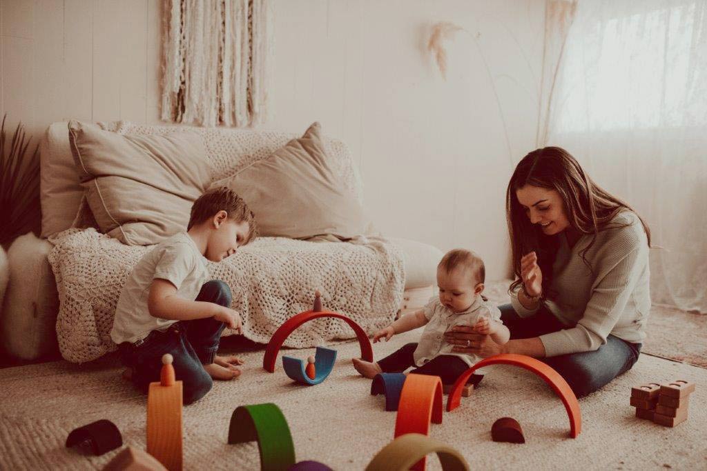 Family playing with wooden toys